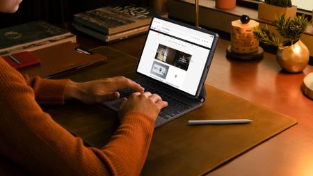 Xiaomi Pad 8 Pro tablet on a desk while a person types on the keyboard