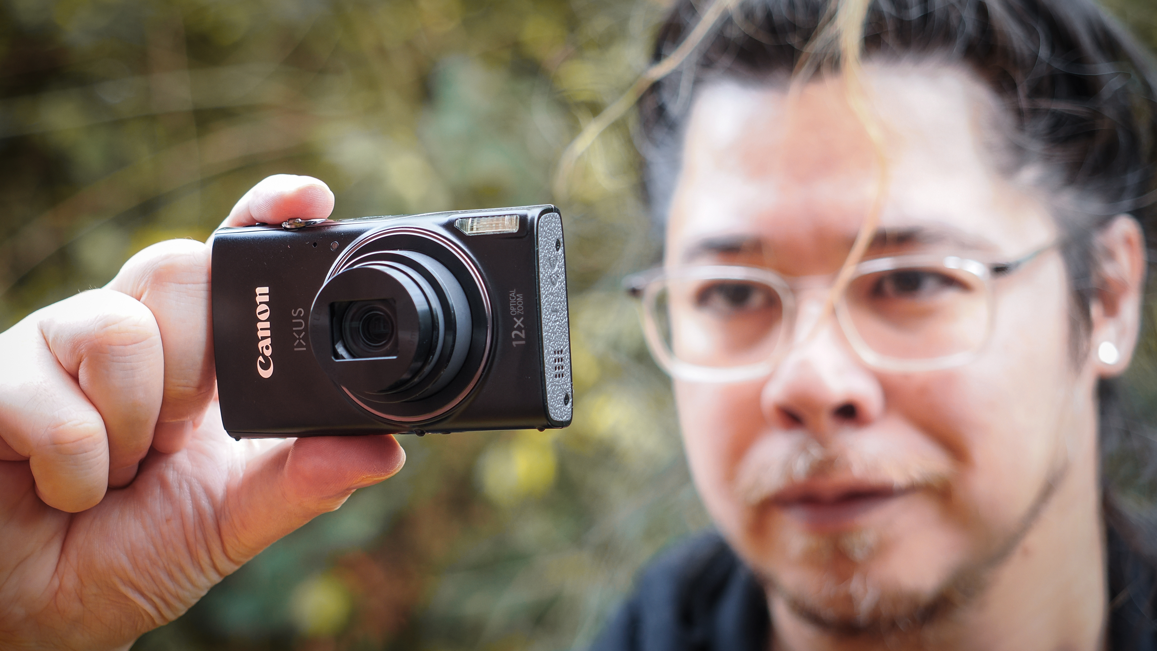 Canon PowerShot Elph 360 HS A / Canon Ixus 285 HS A being held by photographer James Artaius
