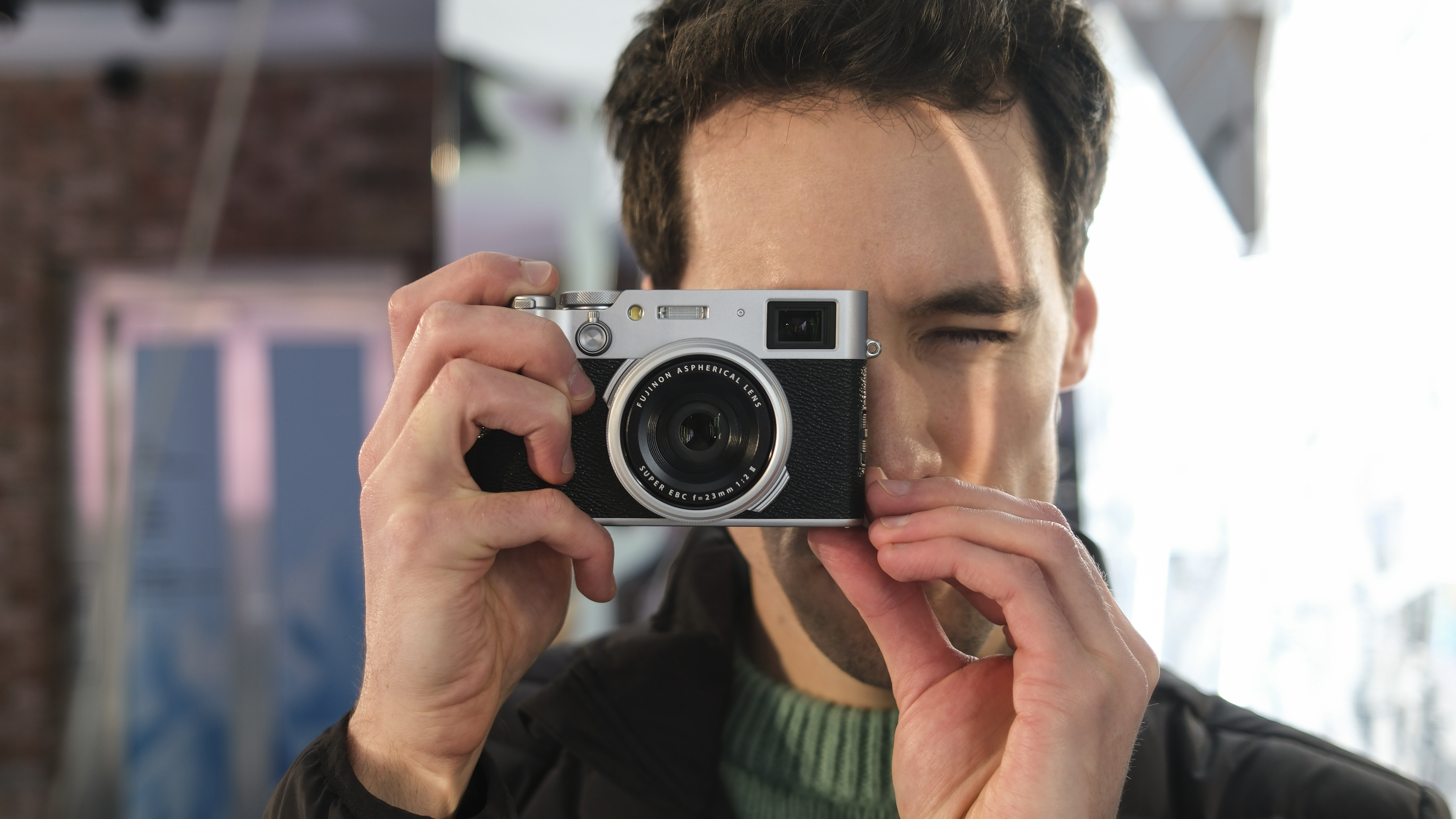 Gareth Bevan holding Fujifilm X100VI compact camera 